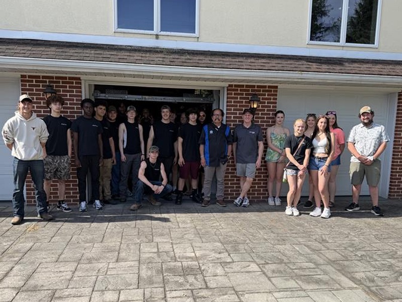 The students also got to tour Carlisle Event’s Co-Owner Lance Miller’s nearby collection of cars and posed for a photo outside of the collection